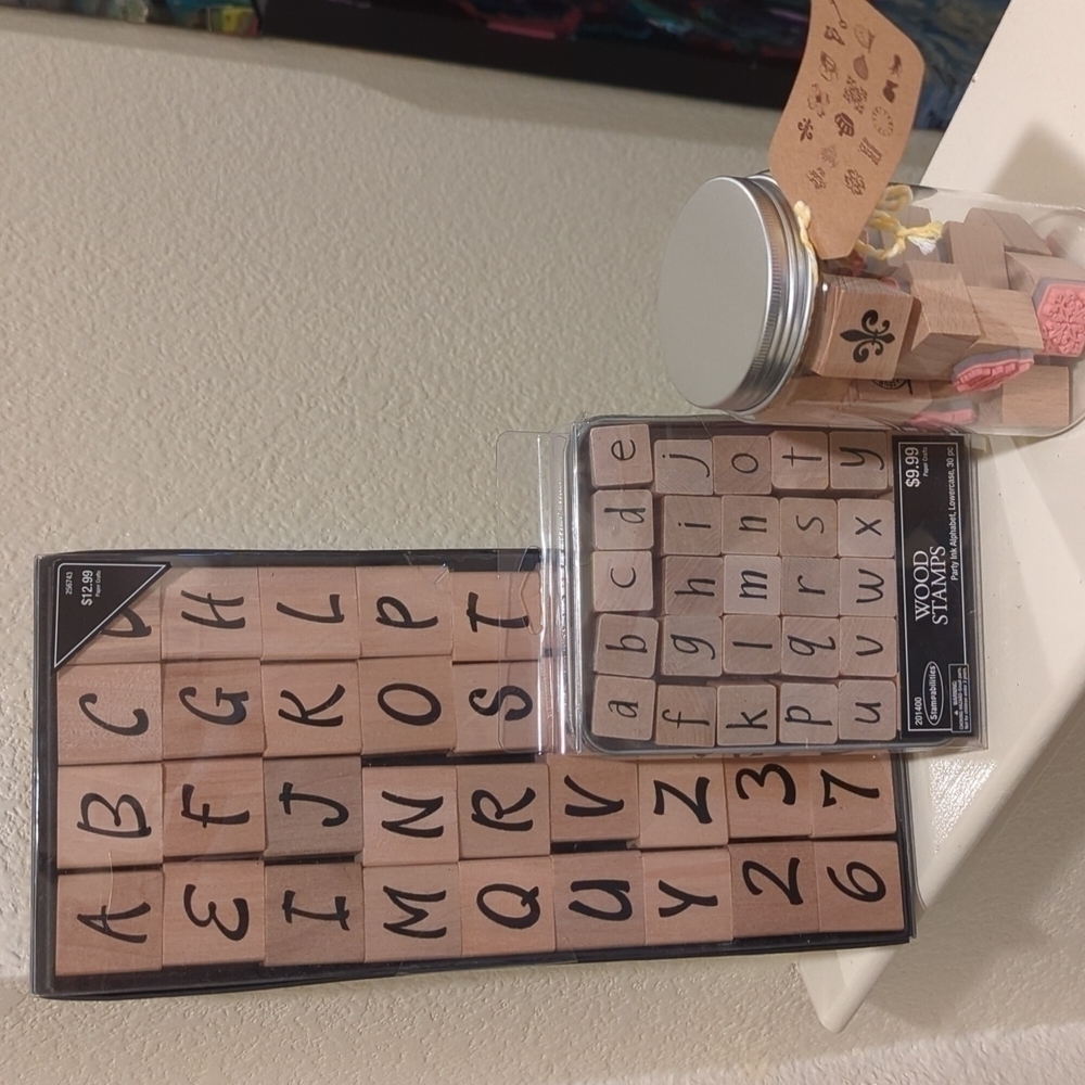 NEWTHREE brand new unopened a through z stamp sets upper and lowercase alphabet.